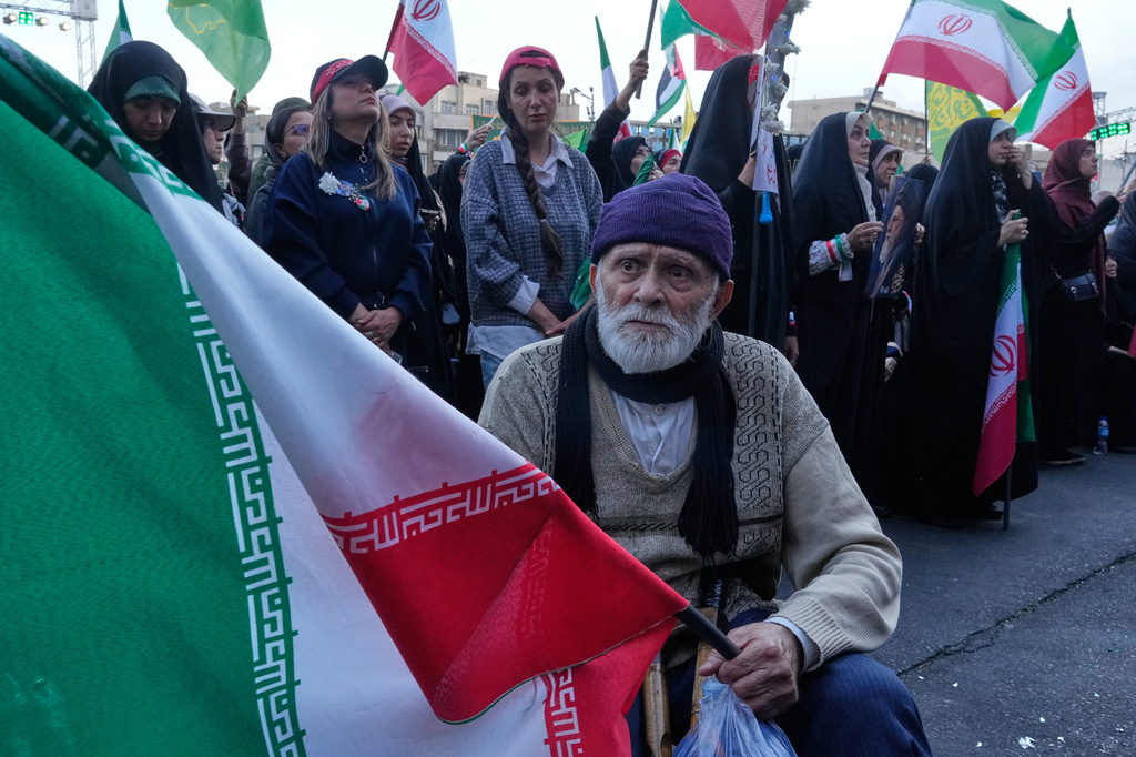 A man holds an Iranian flag in a state-organised rally in Tehran, Iran, Wednesday, April 29, 2026, celebrating the birthday of Imam Reza, the 8th Shiite Muslims' Imam, and supporting Iranian Supreme Leader Ayatollah Mojtaba Khamenei. (AP Photo/Vahid Salemi)