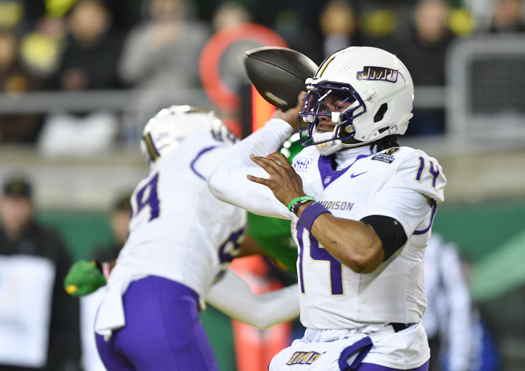 FILE - James Madison quarterback Alonza Barnett III (14) throws a pass against Oregon during the second half in the first round of the NCAA College Football Playoff, Saturday, Dec. 20, 2025, in Eugene, Ore. (AP Photo/Mark Ylen, file)