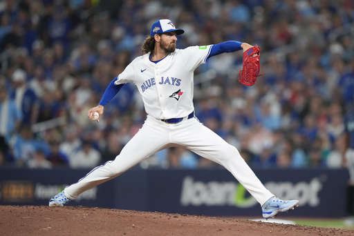 Toronto Blue Jays pitcher Kevin Gausman delivers against the Seattle Mariners during the seventh inning in Game 7 of baseball's American League Championship Series in Toronto, Monday, Oct. 20, 2025. (Nathan Denette/The Canadian Press via AP) Toronto Blue Jays pitcher Kevin Gausman delivers against the Seattle Mariners during the seventh inning in Game 7 of baseball's American League Championship Series in Toronto, Monday, Oct. 20, 2025. (Nathan Denette/The Canadian Press via AP)