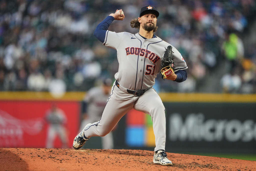 Houston Astros relief pitcher Ryan Weiss throws against the Seattle Mariners during the third inning of a baseball game, Friday, April 10, 2026, in Seattle. (AP Photo/Lindsey Wasson)