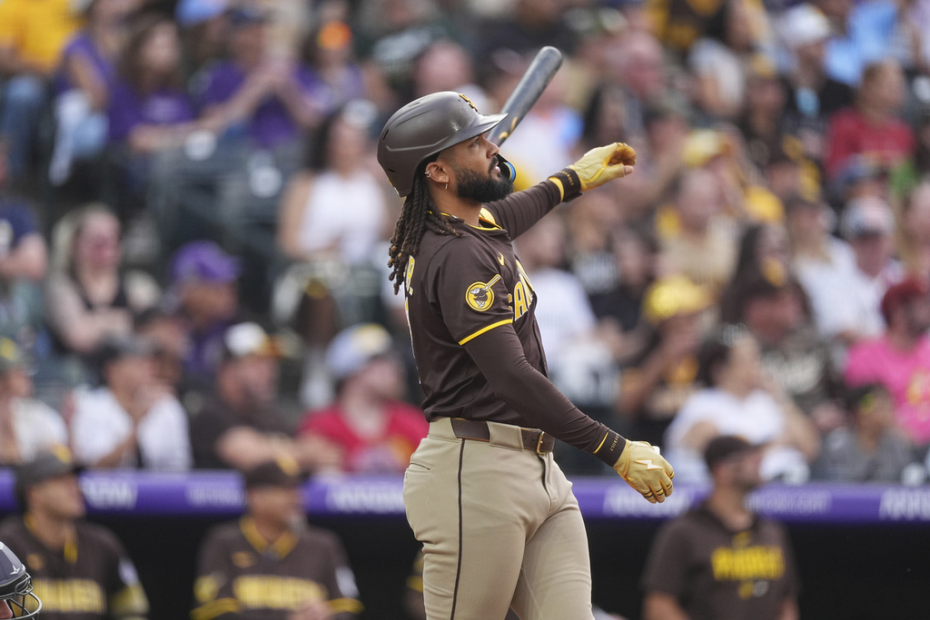 San Diego Padres' Fernando Tatis Jr. tosses his bat after hitting a three-run home run off Colorado Rockies starting pitcher McCade Brown in the second inning of a baseball game Saturday, Sept. 6, 2025, in Denver. (AP Photo/David Zalubowski)