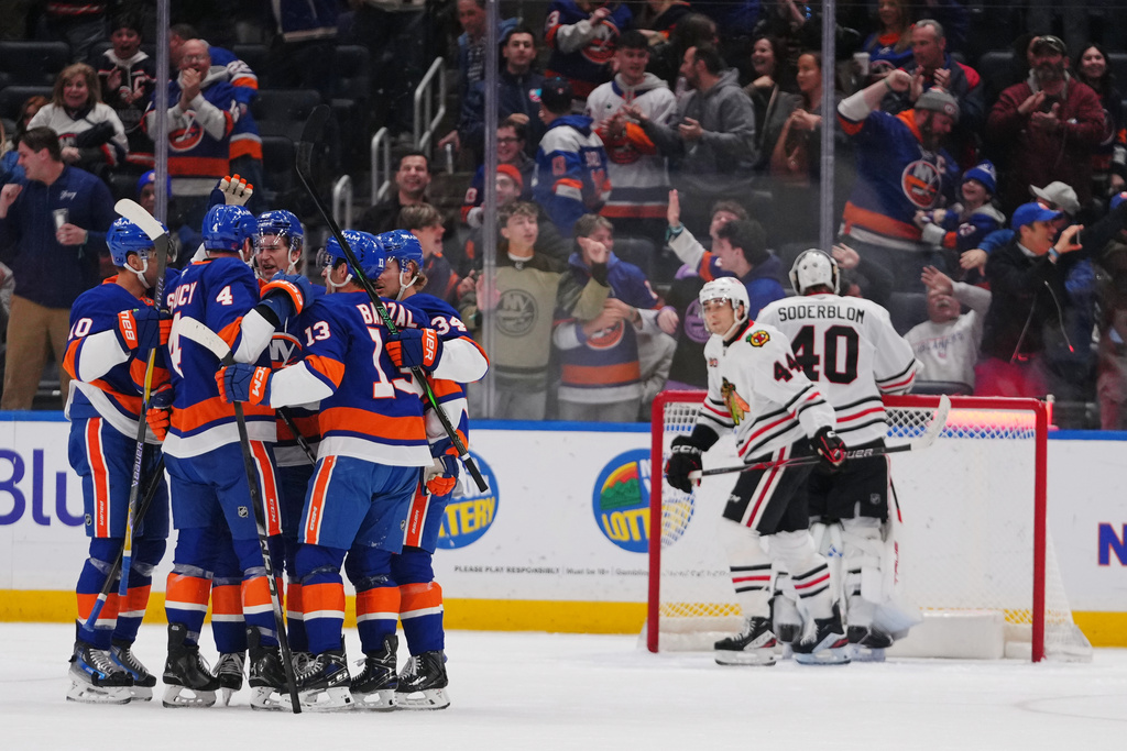 The New York Islanders celebrate a goal by Calum Ritchie during the third period of an NHL hockey game against the Chicago Blackhawks Tuesday, March 24, 2026, in Elmont, N.Y. (AP Photo/Frank Franklin II)
