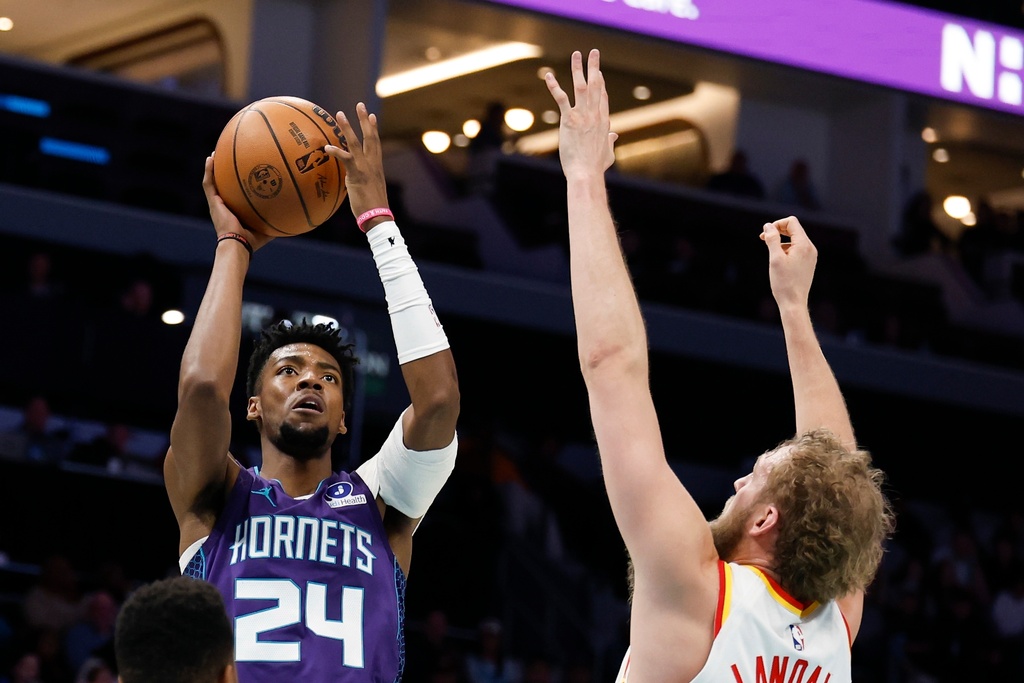 Charlotte Hornets forward Brandon Miller (24) shoots against Atlanta Hawks center Jock Landale during the first half of an NBA basketball game in Charlotte, N.C., Wednesday, Feb. 11, 2026. (AP Photo/Nell Redmond)