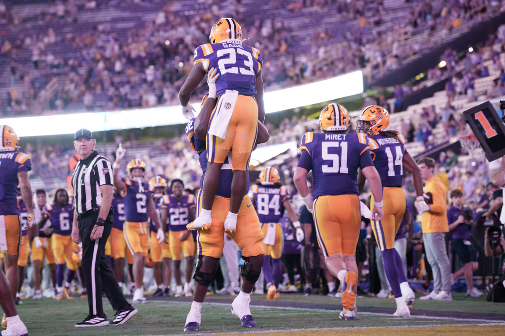 LSU running back Stacy Gage (23) celebrates a touchdown against McNeese during the second half of an NCAA college football game in Baton Rouge, La., Saturday, Oct. 3, 2026. (AP Photo/Matthew Hinton)