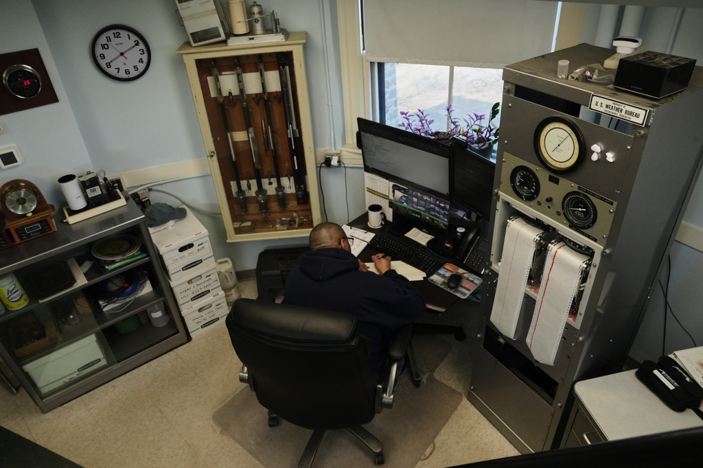 Matthew Douglas, the observatory's chief weather observer, annotates a weather chart in his office at the Blue Hill Observatory and Science Center, Saturday, March 14, 2026, in Milton, Mass. (Laura Martin Agudelo/MIT Graduate Program in Science Writing via AP)