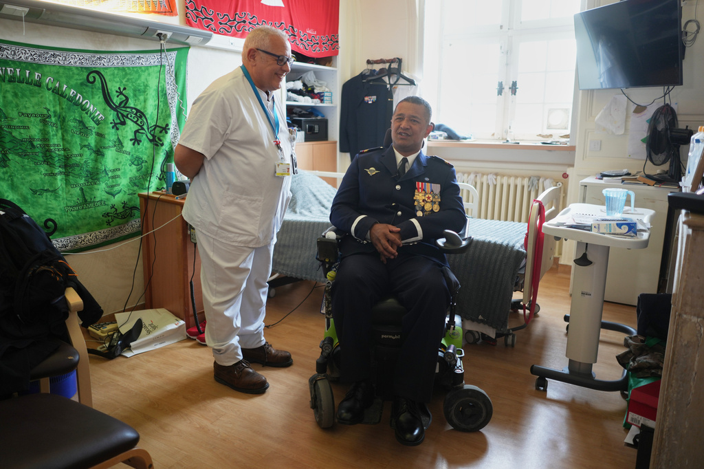 Master corporal Mikaele Iva and nurse coordinator, Mustapha Nachet, talk at the National Institution of Invalides in Paris, on May 6, 2026.(AP Photo/Thibault Camus)