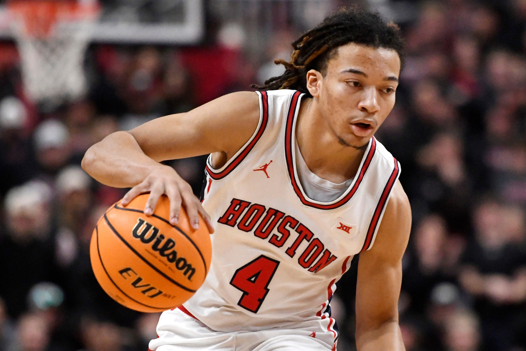 Houston guard Kingston Flemings (4) dribbles the ball during the second half in an NCAA college basketball game against Texas Tech, Saturday, Jan. 24, 2026, in Lubbock, Texas. (AP Photo/Annie Rice)