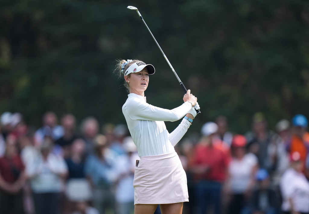 Nelly Korda, of the United States, watches her second shot on the third hole during the final round at the LPGA Canadian Women's Open golf tournament in Edmonton, Alberta, Sunday, Aug. 23, 2026. (Darryl Dyck/The Canadian Press via AP)