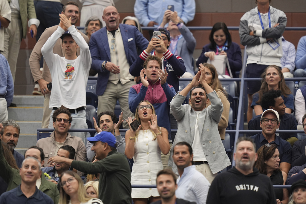 Fans react to President Donald Trump during the men's singles final of the U.S. Open tennis championships, Sunday, Sept. 7, 2025, in New York. (AP Photo/Seth Wenig)