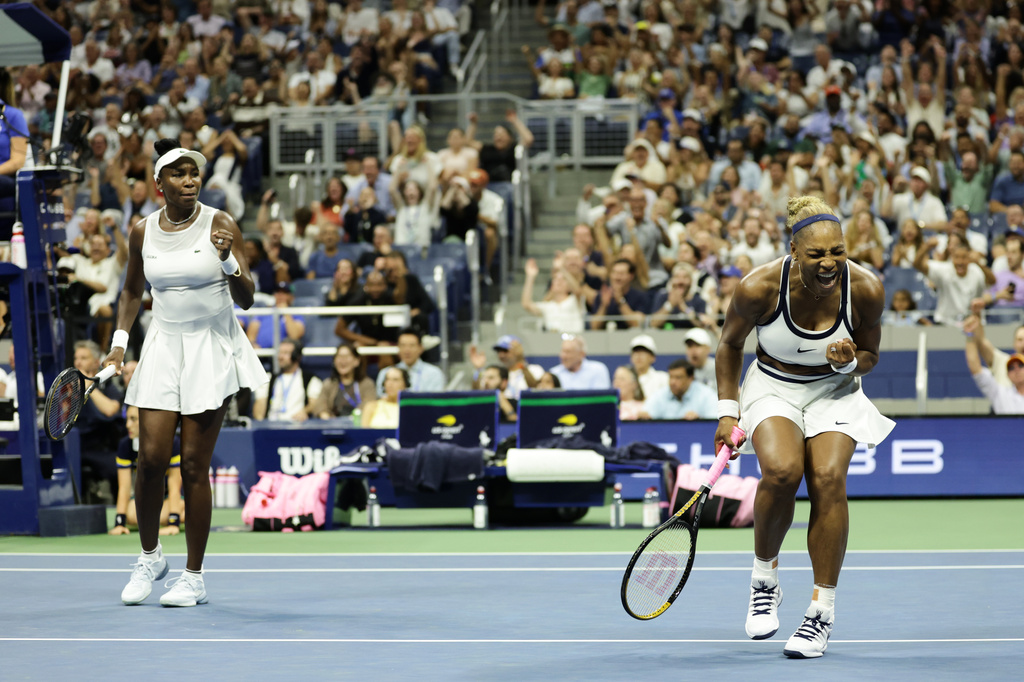 Serena Williams, right, and Venus Williams, of the United States, celebrates after a point against Hao-Ching Chan, of Taiwan, and Maya Joint, at the U.S. Open tennis championships, Friday, Sept. 4, 2026, in New York. (AP Photo/Adam Hunger)