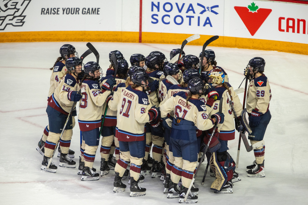Montreal Victoire players celebrate their shootout win over the Toronto Sceptres in PWHL Takeover Tour game in Halifax, Wednesday, Dec. 17, 2025. (Riley Smith/The Canadian Press via AP)