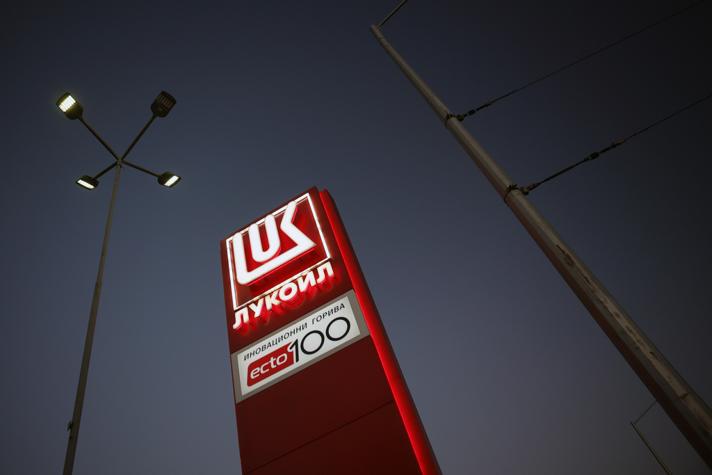 A logo of a Lukoil petrol station is illuminated in Sofia, Bulgaria, Tuesday, Oct. 28, 2025. (AP Photo/ Valentina Petrova)