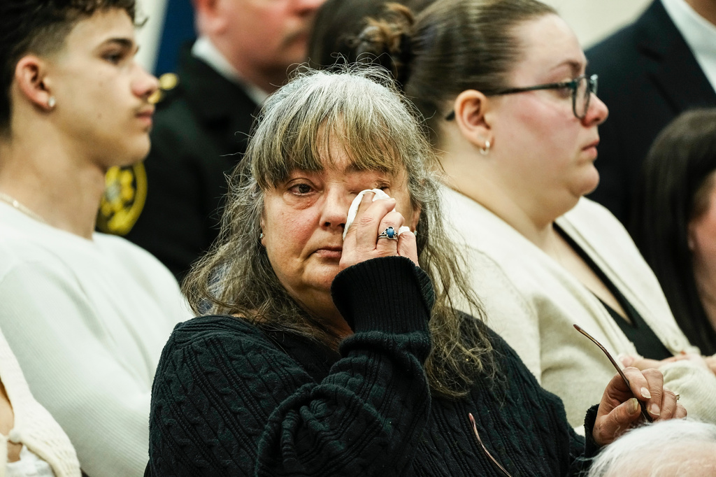 Family members of victims react as they listen Suffolk County District Attorney Raymond A. Tierney during a news conference after Rex Heuermann, accused in Long Island's Gilgo Beach serial killings, pleaded guilty on Wednesday, April 8, 2026, at Suffolk County Police Academy Gymnasium in Brentwood, N.Y. (AP Photo/Eduardo Munoz Alvarez)