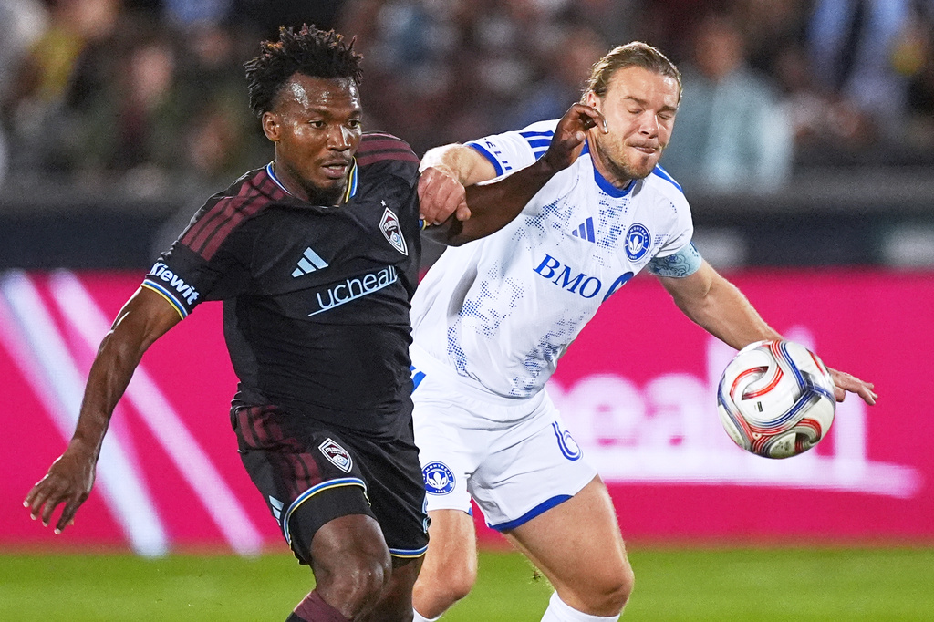 Colorado Rapids midfielder Hamzat Ojediran, left, and CF Montréal midfielder Samuel Piette pursue the ball in the first half of an MLS soccer match Saturday, Sept. 12, 2026, in Dick's Sporting Goods Park in Commerce City, Colo. (AP Photo/David Zalubowski)