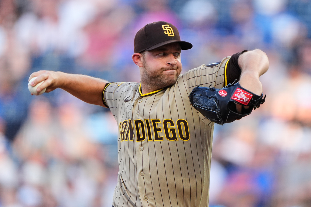 San Diego Padres starting pitcher Michael King throws during the first inning of a baseball game, Friday, July 17, 2026, in Kansas City, Mo. (AP Photo/Charlie Riedel)