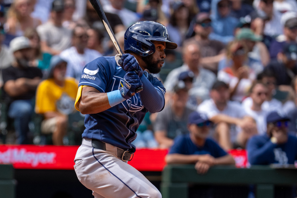 Tampa Bay Rays' Cedric Mullins hits an RBI single during the fifth inning of a baseball game against the Seattle Mariners, Sunday, Aug. 9, 2026, in Seattle. (AP Photo/Stephen Brashear)
