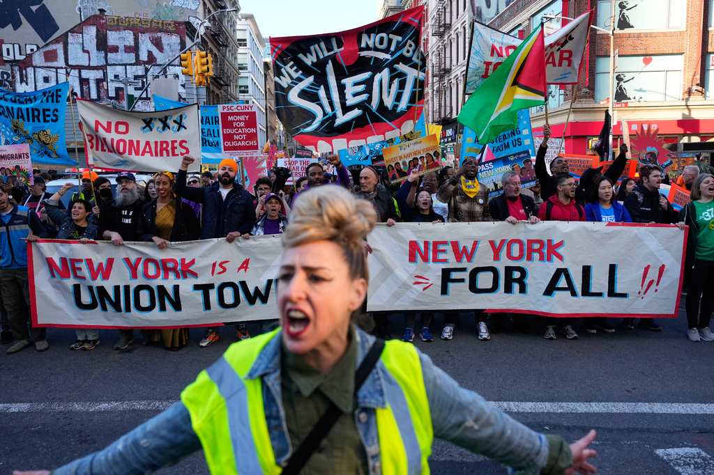 Demonstrators march during a May Day rally in New York, Friday, May 1, 2026. (AP Photo/Yuki Iwamura)