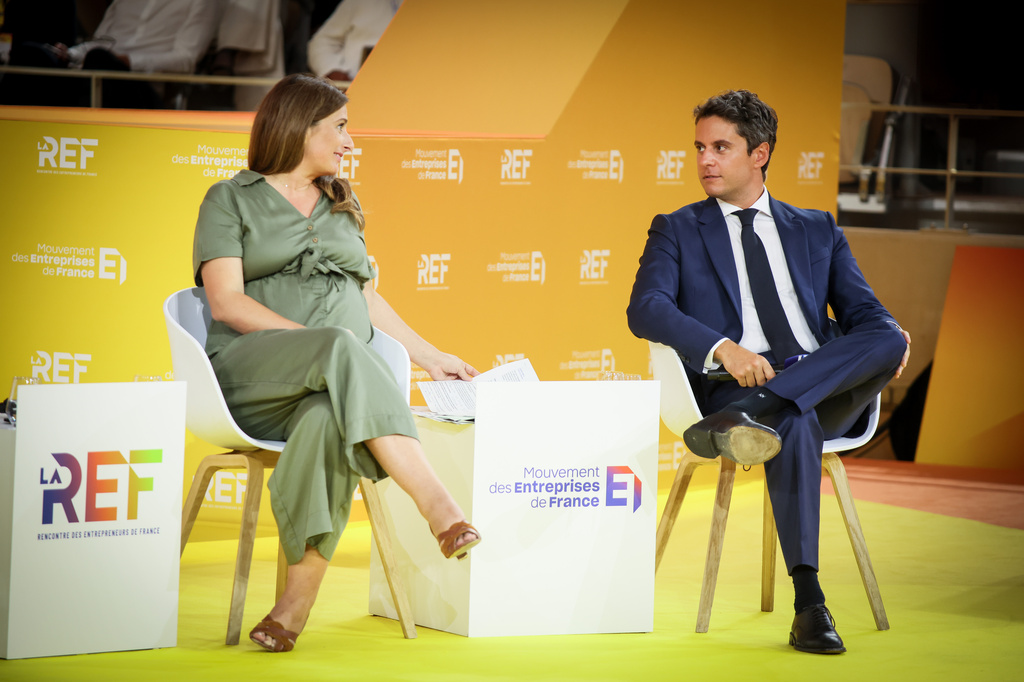 FILE - French Green Party leader Marine Tondelier, left, and Former French Prime minister Gabriel Attal, candidates at presidential election attends the business meeting organized by the French business organization (MEDEF) in Paris, Thursday, Aug. 27, 2026. (AP Photo/Thomas Padilla, File)
