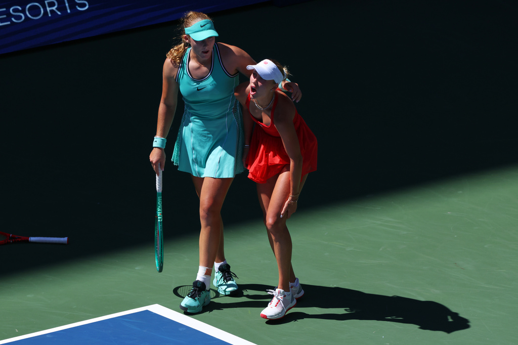 Mirra Andreeva, of Russia, left, helps Anastasia Potapova, of Austria, after Potapova fell during the fourth round of the U.S. Open tennis championships, Monday, Sept. 7, 2026, in New York. (AP Photo/Andres Kudacki)