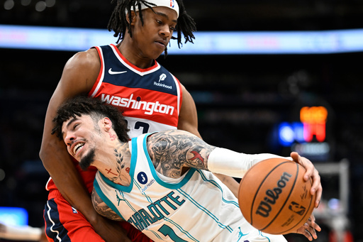 Charlotte Hornets guard LaMelo Ball (1) drives to the basket against Washington Wizards guard Tre Johnson, top, during the first half of an NBA basketball game Sunday, Oct. 26, 2025, in Washington. (AP Photo/John McDonnell) Charlotte Hornets guard LaMelo Ball (1) drives to the basket against Washington Wizards guard Tre Johnson, top, during the first half of an NBA basketball game Sunday, Oct. 26, 2025, in Washington. (AP Photo/John McDonnell)