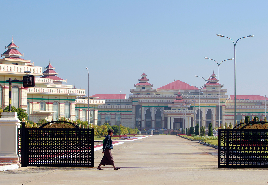 FILE - A man walks in front of Parliament Building in Naypyitaw, Myanmar on Jan. 24, 2018. (AP Photo/Aung Shine Oo, File)