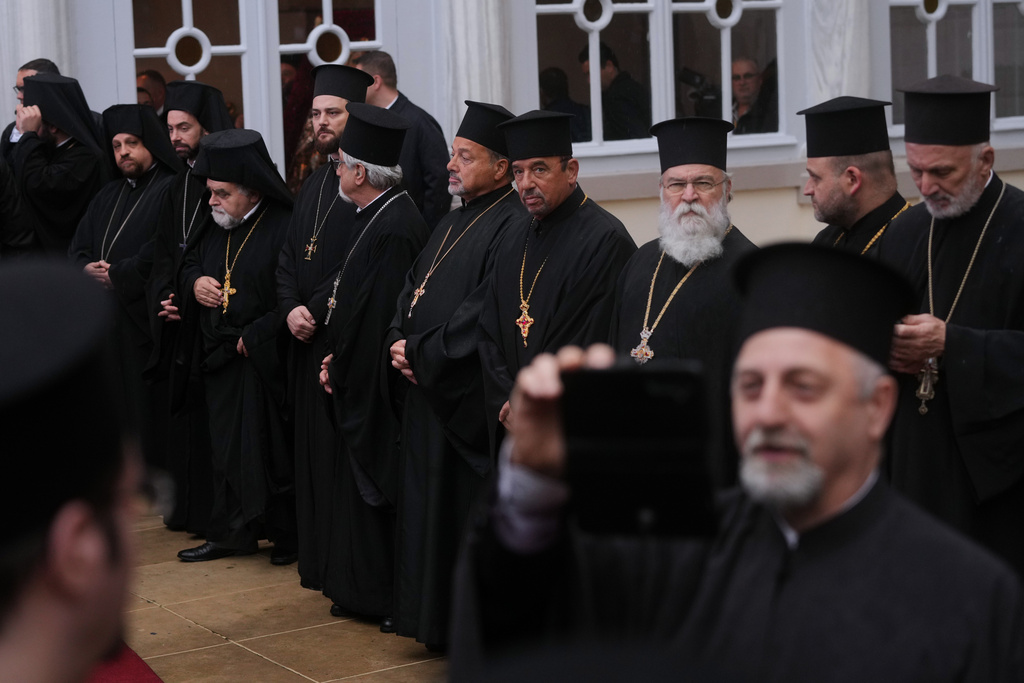 Orthodox clerics wait for Pope Leo XIV to arrive for a doxology service at the Patriarchal Church of Saint George, in Istanbul, Turkey, Saturday, Nov. 29, 2025. (AP Photo/Francisco Seco)