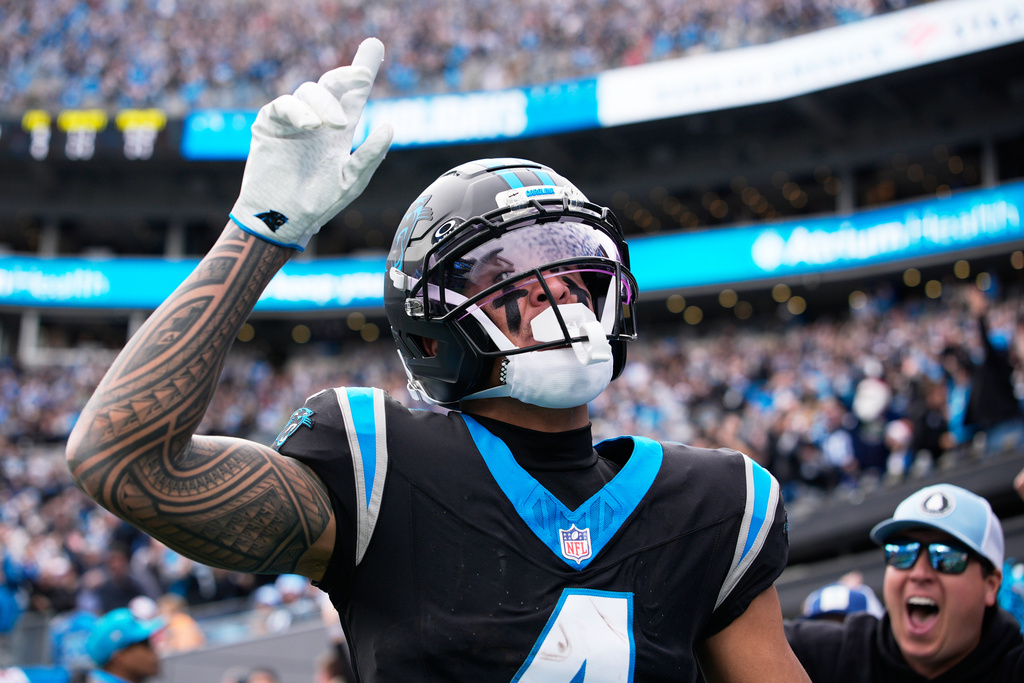 Carolina Panthers wide receiver Tetairoa McMillan celebrates after scoring against the Tampa Bay Buccaneers during the first half of an NFL football game, Sunday, Dec. 21, 2025, in Charlotte, N.C. (AP Photo/Jacob Kupferman)