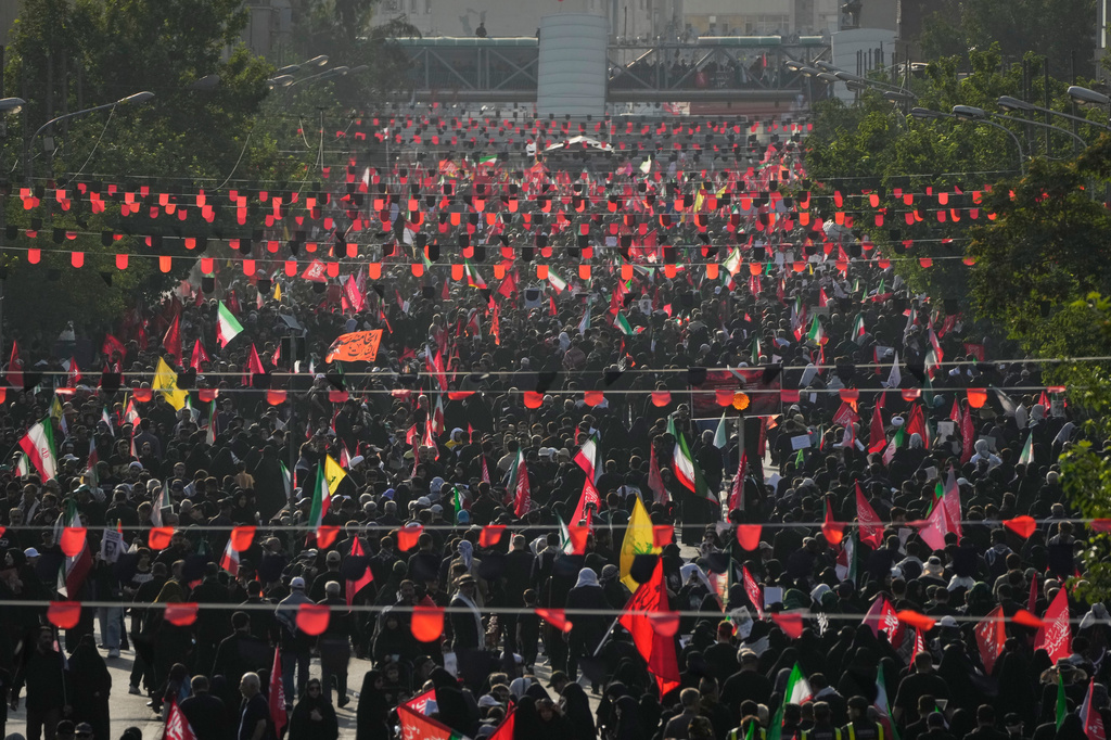 Mourners fill a boulevard as they make their way to the funeral procession of the slain Iranian Supreme Leader Ayatollah Ali Khamenei in Tehran, Iran, Monday, July 6, 2026. (AP Photo/Vahid Salemi)