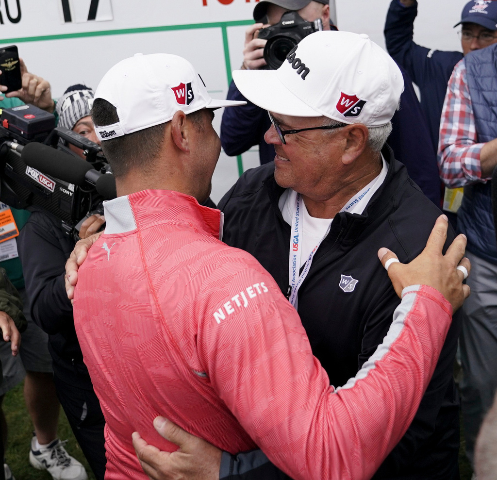 FILE - Gary Woodland celebrates after winning the U.S. Open Championship golf tournament with his father Dan, June 16, 2019, in Pebble Beach, Calif. (AP Photo/Carolyn Kaster, File)