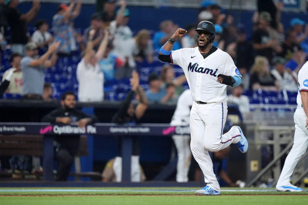 Miami Marlins' Brian Navarreto celebrates as he runs home on a home run by Heriberto Hernandez during the fifth inning of a baseball game against the Philadelphia Phillies, Wednesday, July 29, 2026, in Miami. (AP Photo/Rebecca Blackwell).