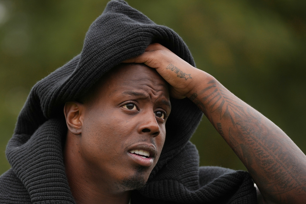 Jacksonville Jaguars running back Travis Etienne (1) speaks during an interview after an NFL football practice at The Grove in Watford, England, Friday, Oct. 17, 2025. (AP Photo/Kin Cheung)