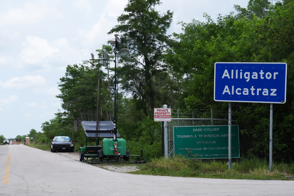 A Florida Highway Patrol car guards the entrance to the "Alligator Alcatraz" detention center Monday, May 11, 2026, in Ochopee, Fla. (AP Photo/Marta Lavandier)