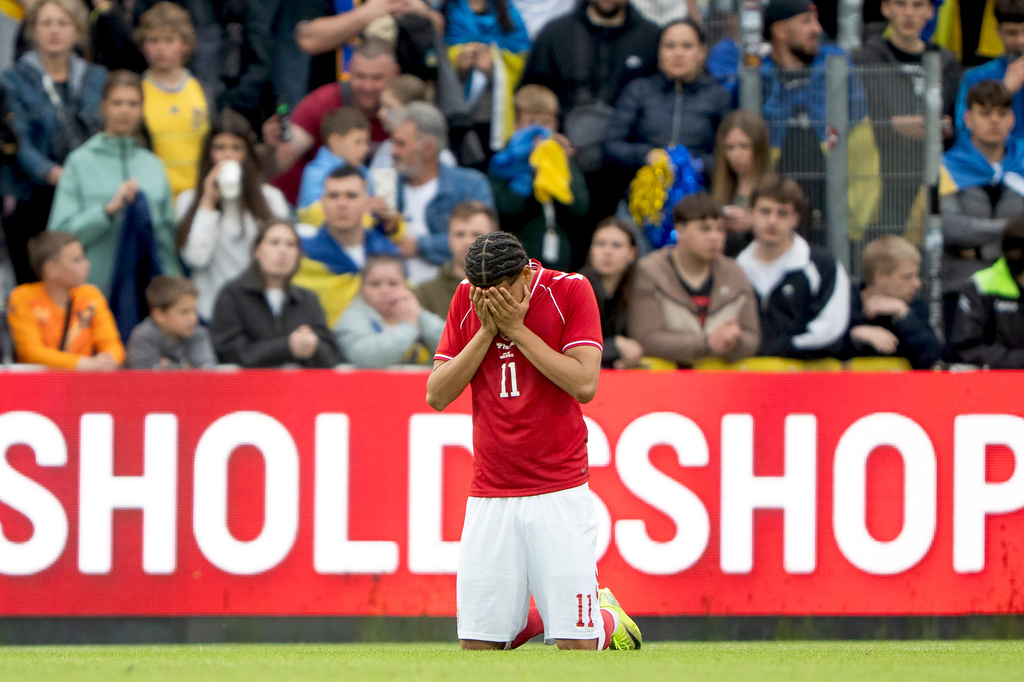 Denmark's William Osula reacts after Denmark's player Christian Eriksen collapsed on the field during the international friendly soccer match between Denmark and Ukraine in Odense, Denmark, Sunday, June 7, 2026. (Bo Amstrup/Ritzau Scanpix via AP)