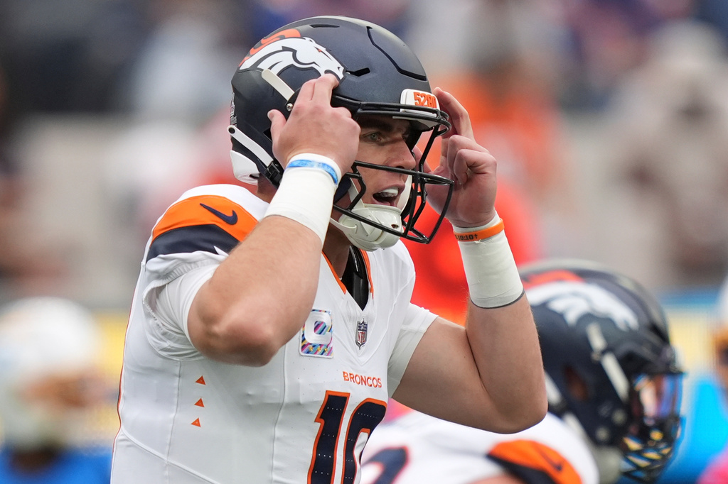 Denver Broncos quarterback Bo Nix gestures before taking a snap during the first half of an NFL football game against the Los Angeles Chargers, Sunday, Oct. 11, 2026, in Inglewood, Calif. (AP Photo/Scott Strazzante)