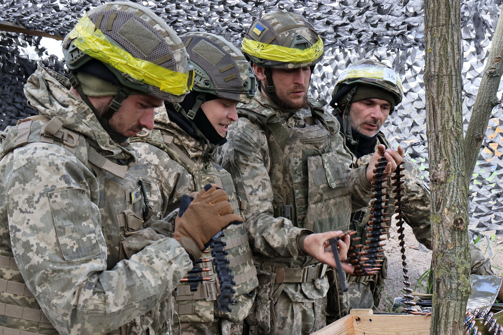 In this photo provided by Ukraine's 65th Mechanized Brigade press service, recruits practice military skills at a training ground near the frontline in the Zaporizhzhia region, Ukraine, Wednesday, April 8, 2026. (Andriy Andriyenko/Ukraine's 65th Mechanized Brigade via AP)