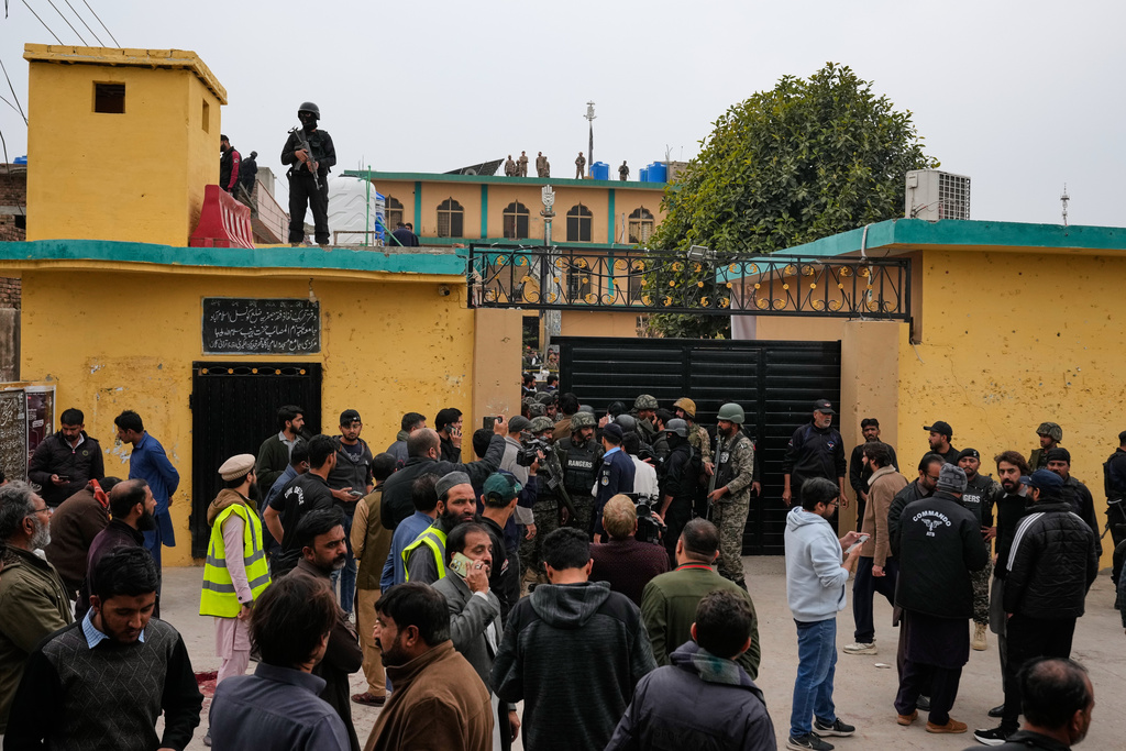 Pakistani security officers and rescue worker gather at the site of a bomb explosion at a Shiite mosque, in Islamabad, Pakistan, Friday, Feb. 6, 2026. (AP Photo/Anjum Naveed)