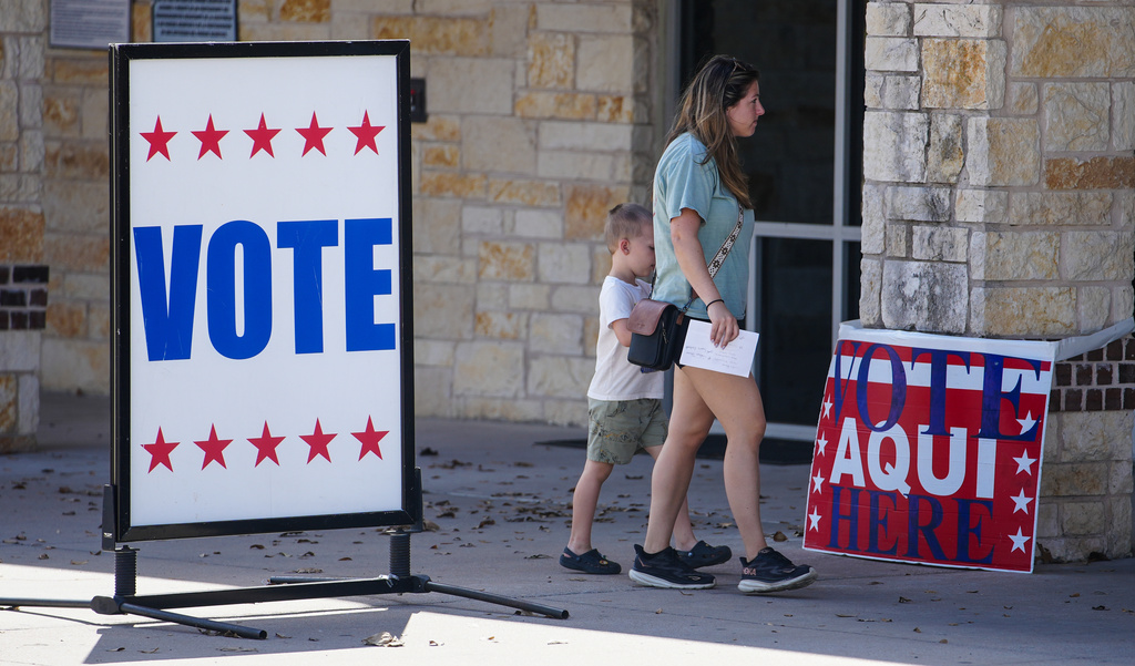 Voters in central Texas make their way to an active polling station to vote in Pflugerville, Texas, Tuesday, March 3, 2026. (Ricardo B. Brazziell/Austin American-Statesman via AP)