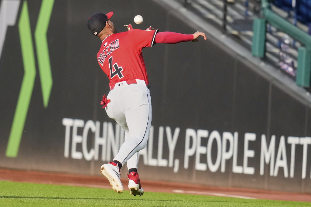 Cleveland Guardians second baseman Brayan Rocchio (4) catches a fly ball hit for an out by Tampa Bay Rays' Junior Caminero in the first inning of a baseball game in Cleveland, Monday, Aug. 25, 2025. (AP Photo/Sue Ogrocki)