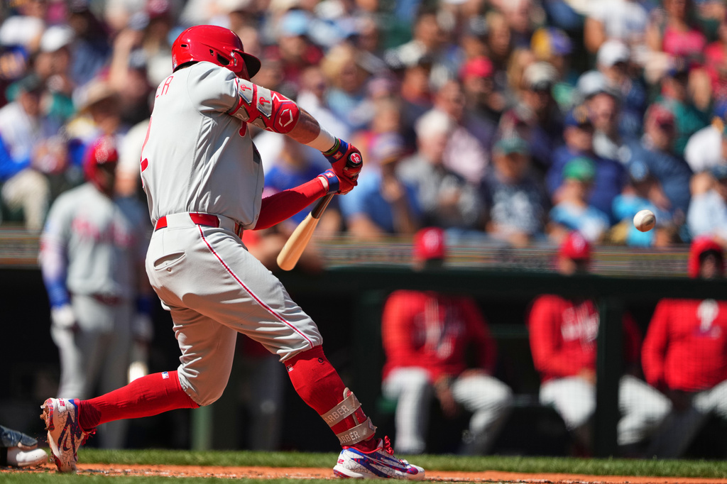 Philadelphia Phillies' Kyle Schwarber hits a three-run home run against Seattle Mariners starting pitcher Bryan Woo during the second inning of a baseball game, Wednesday, Aug. 26, 2026, in Seattle. (AP Photo/Lindsey Wasson)