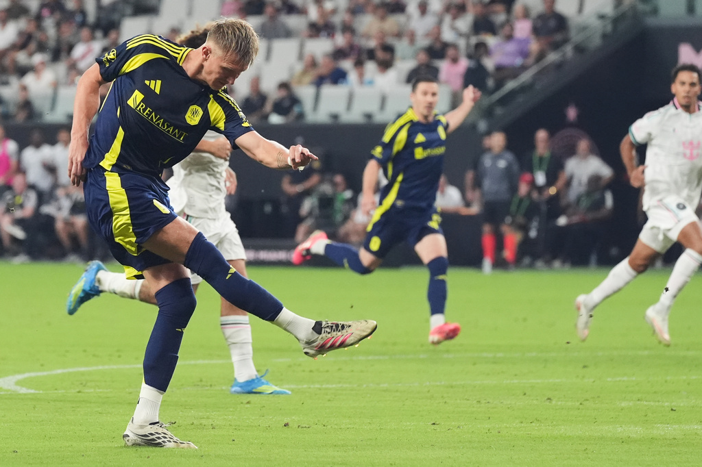Nashville forward Sam Surridge hits the ball to score during the first half of an MLS soccer match against the Inter Miami Saturday, Sept. 12, 2026, in Miami. (AP Photo/Marta Lavandier)