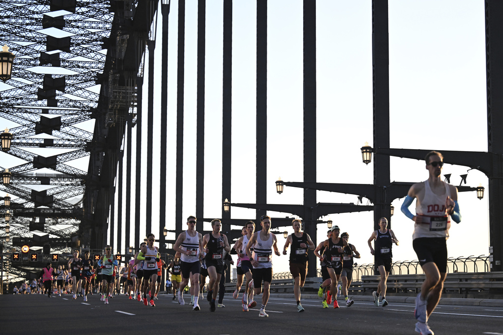 Runners cross the Sydney Harbour Bridge during the Sydney Marathon in Sydney, Sunday, Aug. 31, 2025. (Dean Lewins/AAP Image via AP)