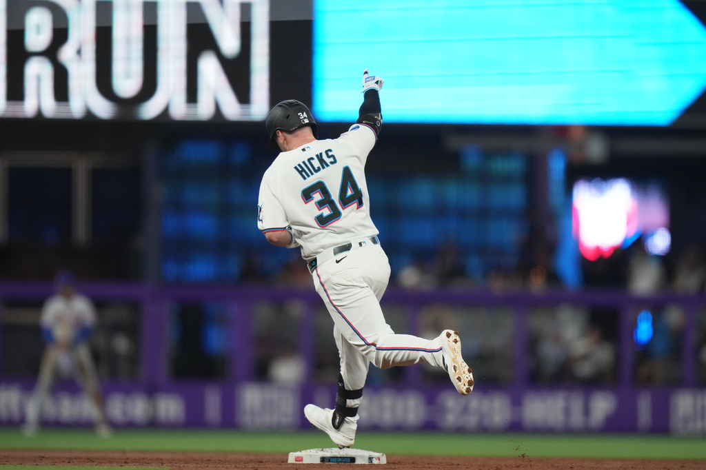 Miami Marlins' Liam Hicks (34) runs the bases after hitting a solo home run during the third inning of a baseball game against the New York Mets, Saturday, May 23, 2026, in Miami. (AP Photo/Lynne Sladky)