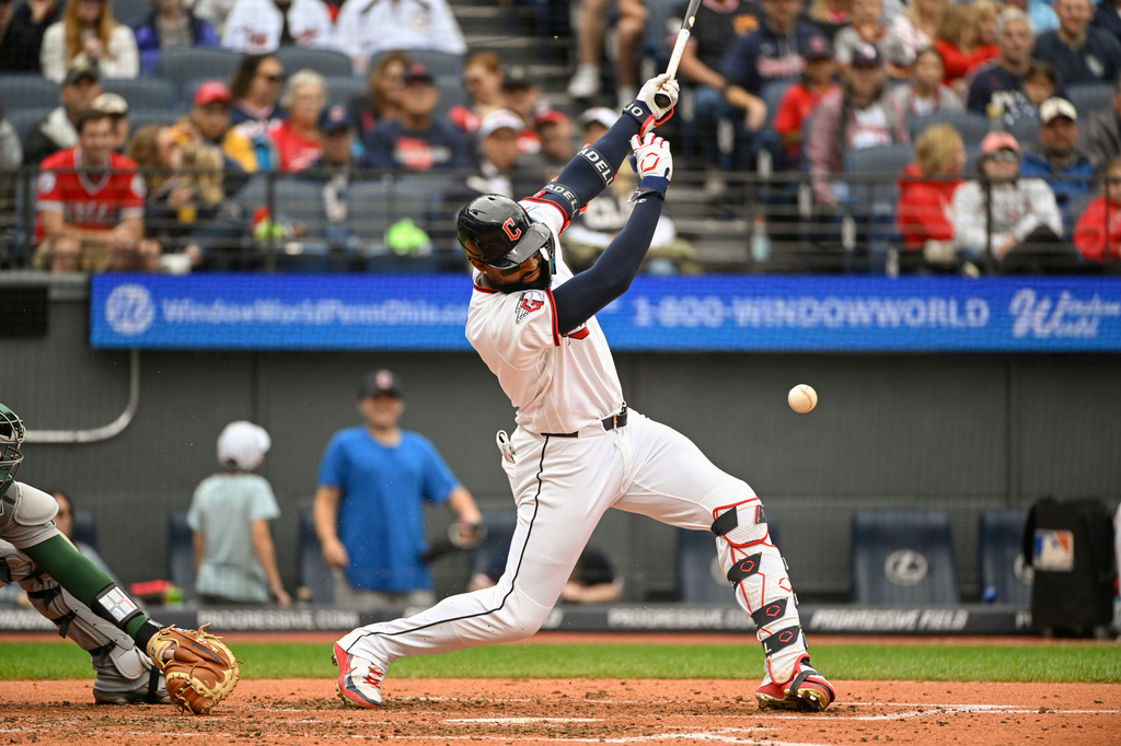 Cleveland Guardians' Jo Adell watches his infield RBI single off Athletics starting pitcher Jack Perkins during the fourth inning of a baseball game, Sunday, Sept. 20, 2026, in Cleveland. (AP Photo/Phil Long)