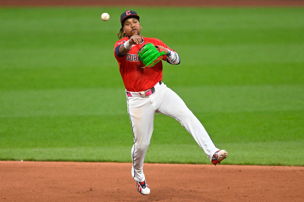 Cleveland Guardians third baseman Jose Ramirez (11) throws to first base in the sixth inning of a baseball game against the Houston Astros in Cleveland, Tuesday, April 21, 2026. (AP Photo/David Richard)