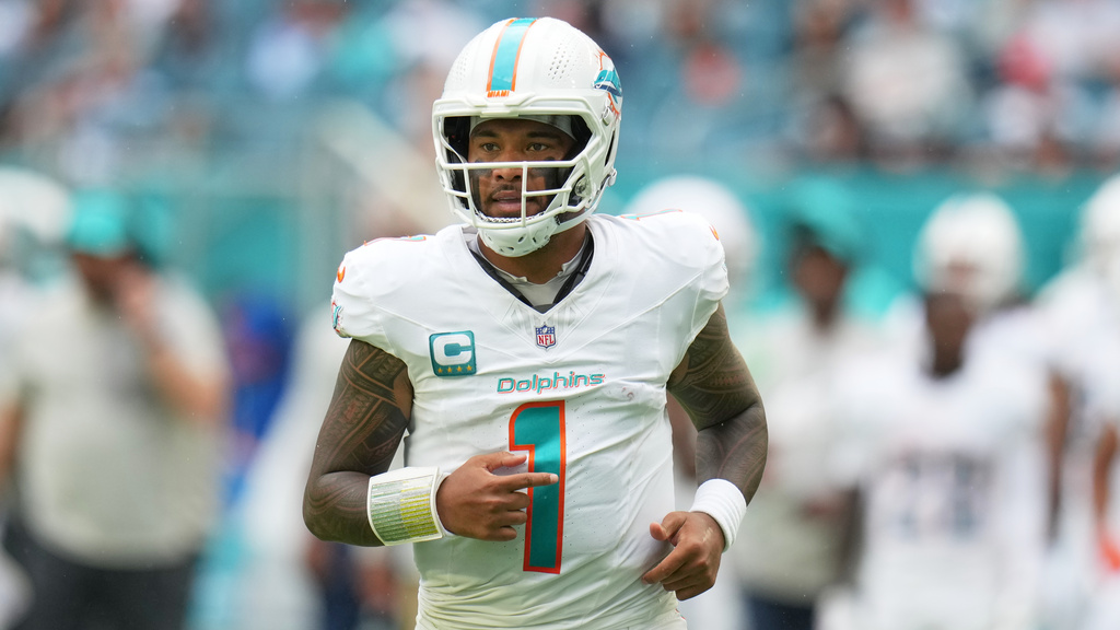 Miami Dolphins quarterback Tua Tagovailoa (1) runs on the field during the second half of an NFL football game against the New Orleans Saints Sunday, Nov. 30, 2025, in Miami Gardens, Fla. (AP Photo/Lynne Sladky)