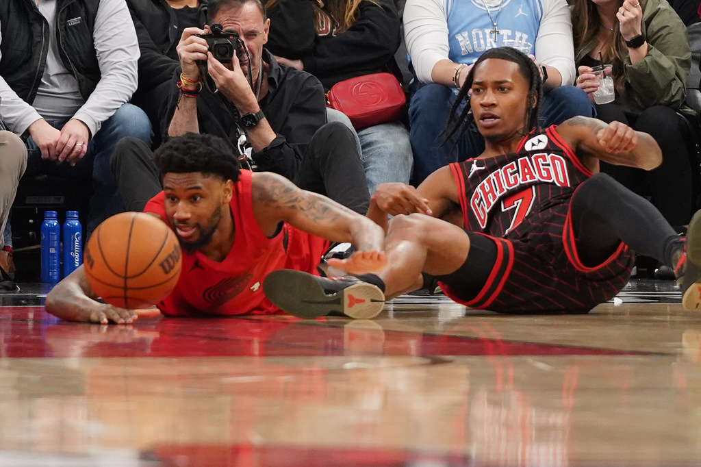 Portland Trail Blazers guard Blake Wesley, left, and Chicago Bulls Rob Dillingham (7) go for the ball during the second half in an NBA basketball game Thursday, Feb. 26, 2026, in Chicago. (AP Photo/David Banks)