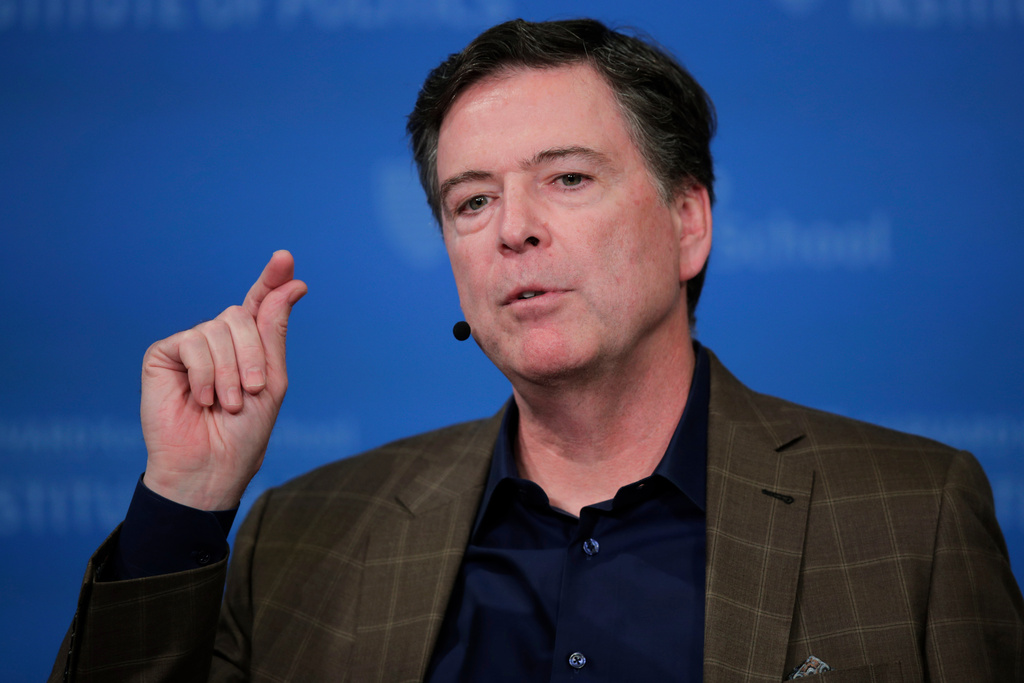 FILE - Former Director of the Federal Bureau of Investigation James Comey speaks at Harvard University's Institute of Politics' JFK Jr. Forum in Cambridge, Mass., Feb. 24, 2020. (AP Photo/Charles Krupa, File)
