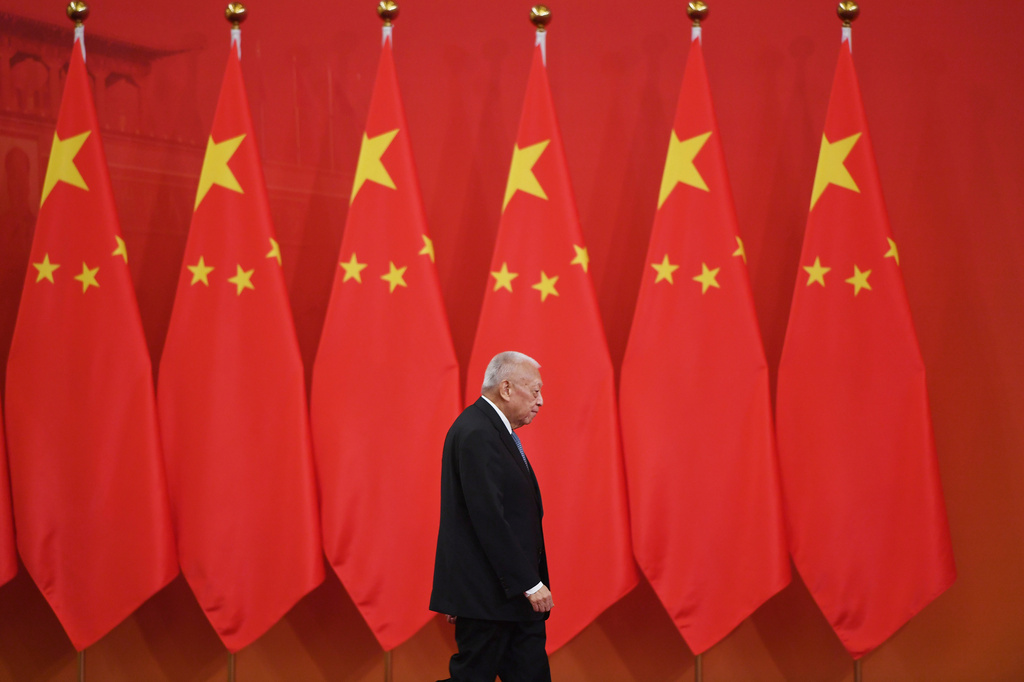 FILE - Former Hong Kong Chief Executive Tung Chee-hwa walks out to receive an award from Chinese President Xi Jinping at a ceremony in Beijing's Great Hall of the People Sept. 29, 2019. (Greg Baker/Pool Photo via AP, File)