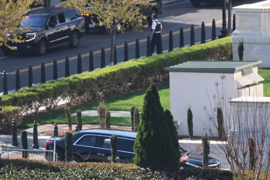 President Donald Trump's motorcade arrives at the U.S. Supreme Court, Wednesday, April 1, 2026, in Washington. (AP Photo/Tom Brenner)