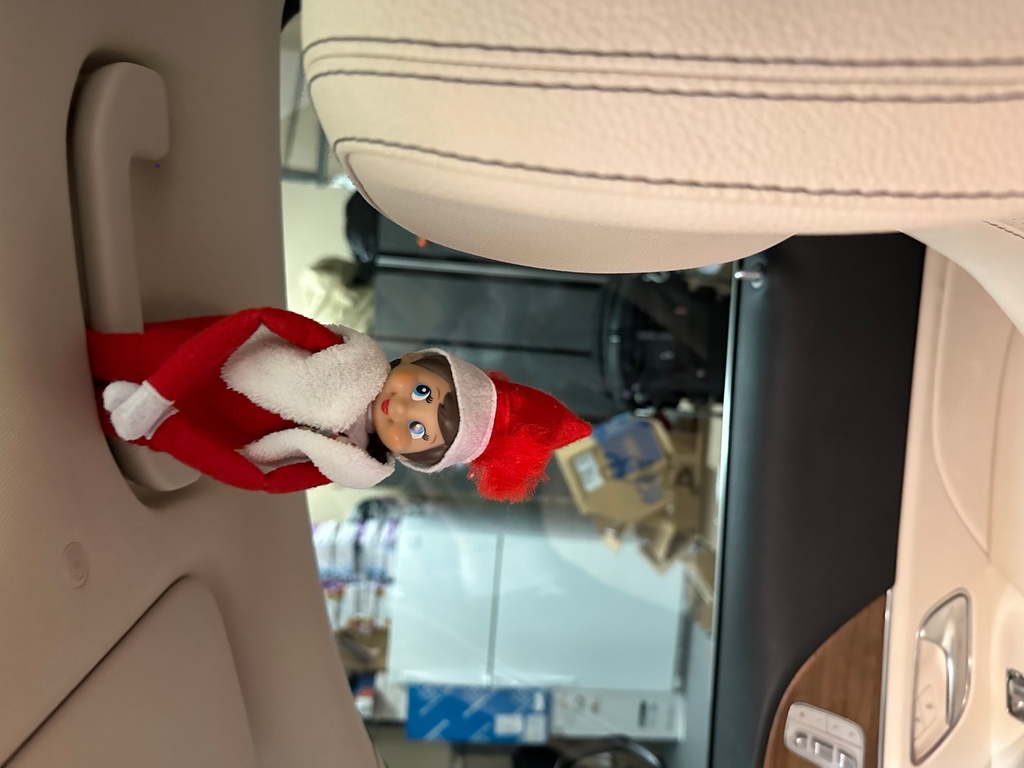 An Elf on the Shelf doll appears upside down in a car at the home of Antonia Katsanos in Franklin Lakes, N.J. on Dec. 17, 2023. (Antonia Katsanos via AP)